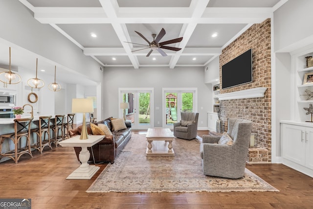 377 Parker Rd, Mcdonough, GA 30252 - living room with wood-type flooring, a ceiling fan, coffered ceiling, beam ceiling, and a towering ceiling