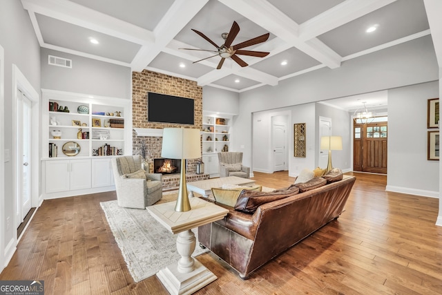 377 Parker Rd, Mcdonough, GA 30252 - living area featuring a brick fireplace, ceiling fan, baseboards, beamed ceiling, and coffered ceiling