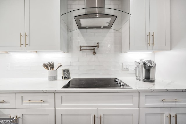 377 Parker Rd, Mcdonough, GA 30252 - kitchen featuring extractor fan, black electric stovetop, and white cabinets