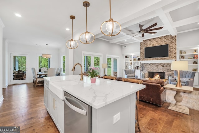 377 Parker Rd, Mcdonough, GA 30252 - kitchen featuring stainless steel dishwasher, a sink, a ceiling fan, recessed lighting, and light stone countertops