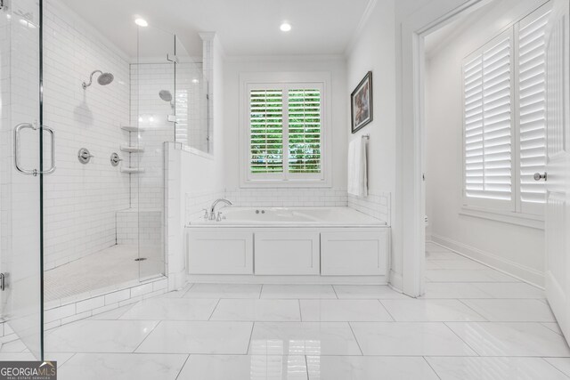 377 Parker Rd, Mcdonough, GA 30252 - full bath featuring a bath, a shower stall, crown molding, toilet, and baseboards
