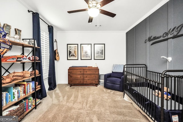 377 Parker Rd, Mcdonough, GA 30252 - carpeted bedroom featuring crown molding, baseboards, ceiling fan, and a nursery area