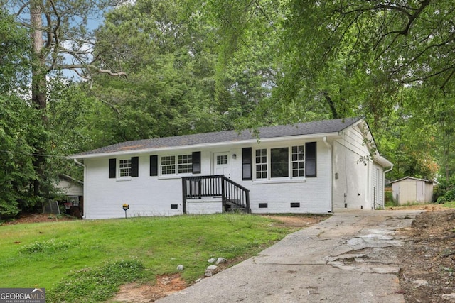 2765 Ocean Valley Dr, Atlanta, GA 30349 - ranch-style home with crawl space, brick siding, concrete driveway, and a front yard