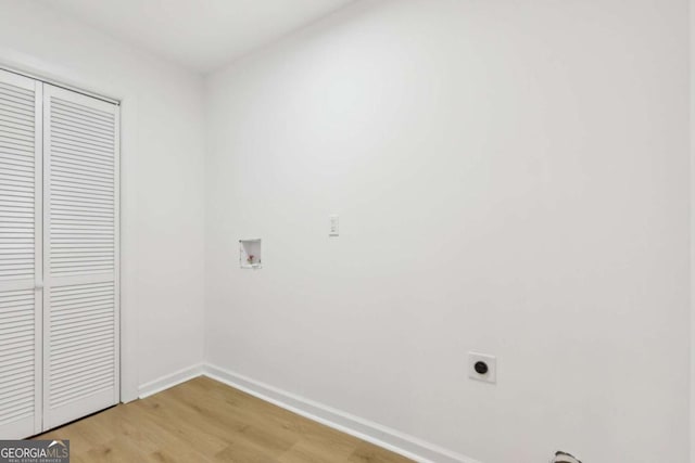 2765 Ocean Valley Dr, Atlanta, GA 30349 - laundry room with light wood-type flooring, electric dryer hookup, hookup for a washing machine, and baseboards