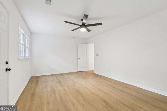 2765 Ocean Valley Dr, Atlanta, GA 30349 - empty room with light wood-style flooring, baseboards, and a ceiling fan
