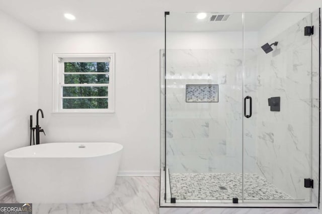 2765 Ocean Valley Dr, Atlanta, GA 30349 - full bath featuring marble finish floors, a freestanding tub, a marble finish shower, recessed lighting, and baseboards