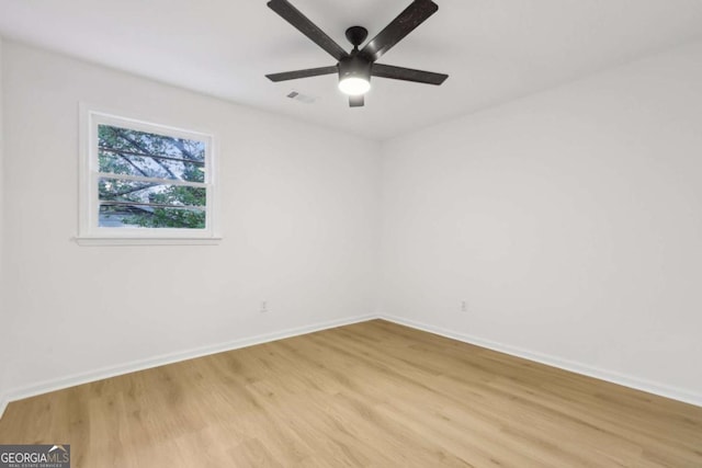 2765 Ocean Valley Dr, Atlanta, GA 30349 - unfurnished room featuring light wood finished floors, baseboards, and ceiling fan