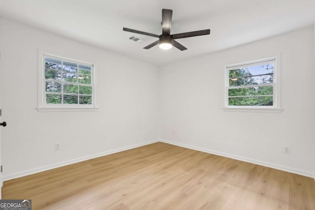 2765 Ocean Valley Dr, Atlanta, GA 30349 - unfurnished room with light wood finished floors, baseboards, and a ceiling fan