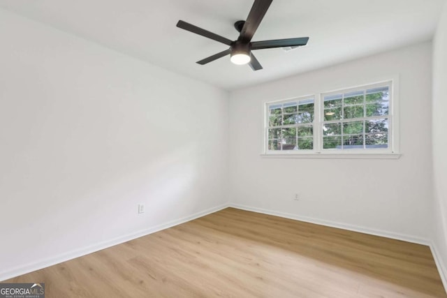 2765 Ocean Valley Dr, Atlanta, GA 30349 - empty room featuring light wood-style floors, baseboards, and ceiling fan