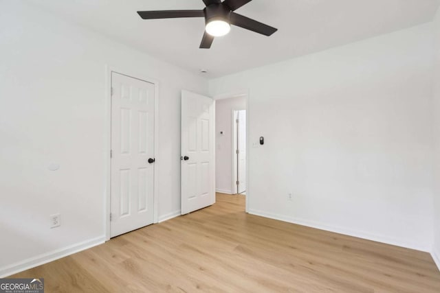 2765 Ocean Valley Dr, Atlanta, GA 30349 - unfurnished bedroom with light wood-type flooring, baseboards, and ceiling fan