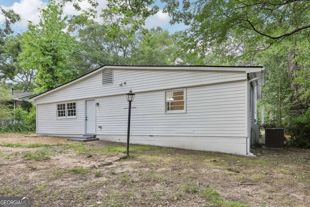 2765 Ocean Valley Dr, Atlanta, GA 30349 - back of house featuring central AC unit and entry steps
