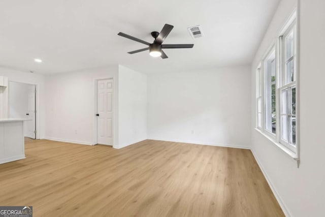 2765 Ocean Valley Dr, Atlanta, GA 30349 - unfurnished room with light wood-style flooring, baseboards, a ceiling fan, and recessed lighting