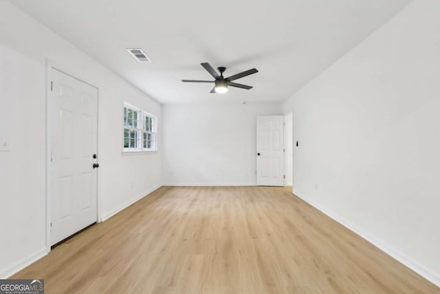 2765 Ocean Valley Dr, Atlanta, GA 30349 - spare room with light wood-style flooring, baseboards, and ceiling fan