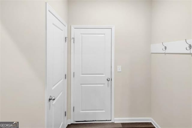 104 Auburn Xing, Auburn, GA 30011 - laundry room with wood finished floors and baseboards