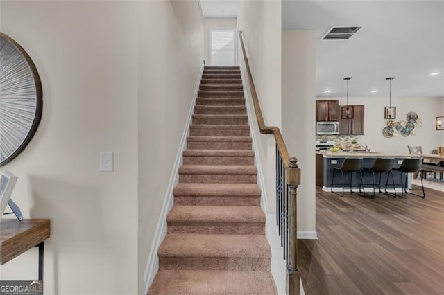 104 Auburn Xing, Auburn, GA 30011 - stairs with wood finished floors and recessed lighting