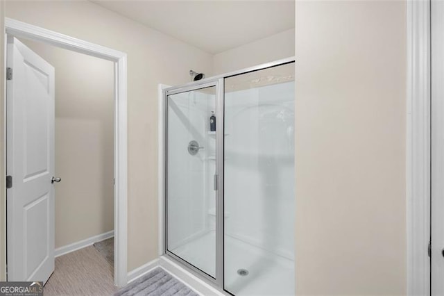 104 Auburn Xing, Auburn, GA 30011 - full bathroom featuring a stall shower and baseboards