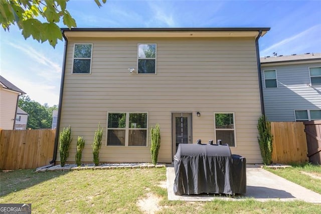 104 Auburn Xing, Auburn, GA 30011 - back of house featuring a patio