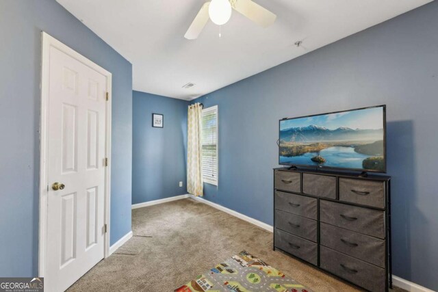 7077 Biltmore Trce, Lithonia, GA 30058 - unfurnished bedroom with carpet floors and ceiling fan