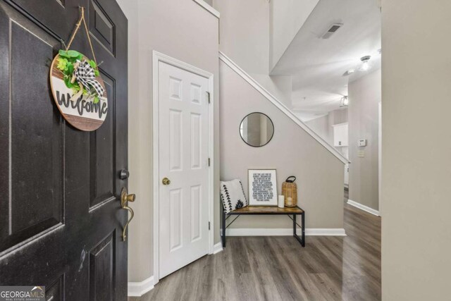7077 Biltmore Trce, Lithonia, GA 30058 - entrance foyer with wood finished floors and baseboards
