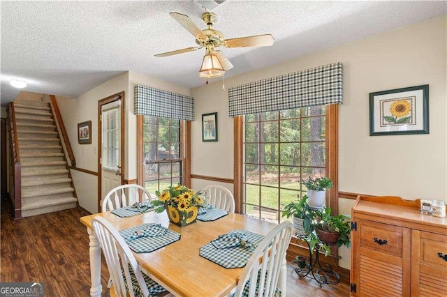 3472 Honeycomb Dr SE, Conyers, GA 30094 - dining room with a textured ceiling, wood finished floors, stairs, and ceiling fan