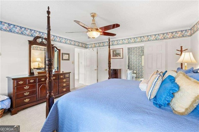 3472 Honeycomb Dr SE, Conyers, GA 30094 - bedroom with carpet floors, a ceiling fan, crown molding, and connected bathroom