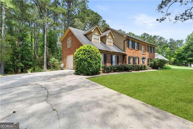3472 Honeycomb Dr SE, Conyers, GA 30094 - view of front of house with a garage, driveway, a front yard, and brick siding