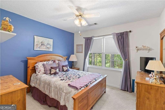 3472 Honeycomb Dr SE, Conyers, GA 30094 - bedroom with light carpet, a textured ceiling, and a ceiling fan