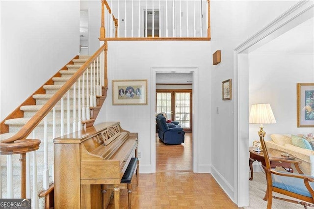 3472 Honeycomb Dr SE, Conyers, GA 30094 - staircase with baseboards and a towering ceiling