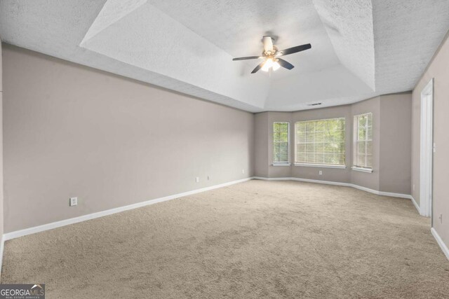 470 Piney Way SW, Atlanta, GA 30331 - unfurnished room featuring a tray ceiling, a textured ceiling, a ceiling fan, carpet, and baseboards