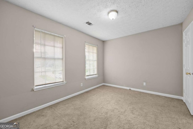 470 Piney Way SW, Atlanta, GA 30331 - spare room featuring carpet, baseboards, and a textured ceiling