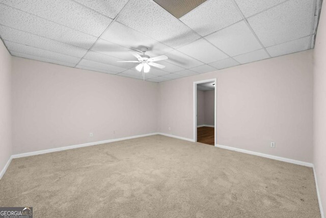 470 Piney Way SW, Atlanta, GA 30331 - spare room with carpet, a paneled ceiling, baseboards, and a ceiling fan