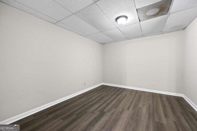 470 Piney Way SW, Atlanta, GA 30331 - empty room with a paneled ceiling, dark wood-type flooring, and baseboards