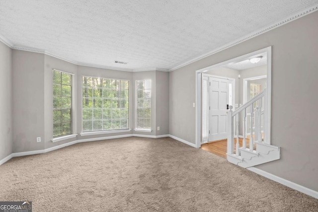 470 Piney Way SW, Atlanta, GA 30331 - carpeted spare room featuring baseboards, a textured ceiling, and ornamental molding