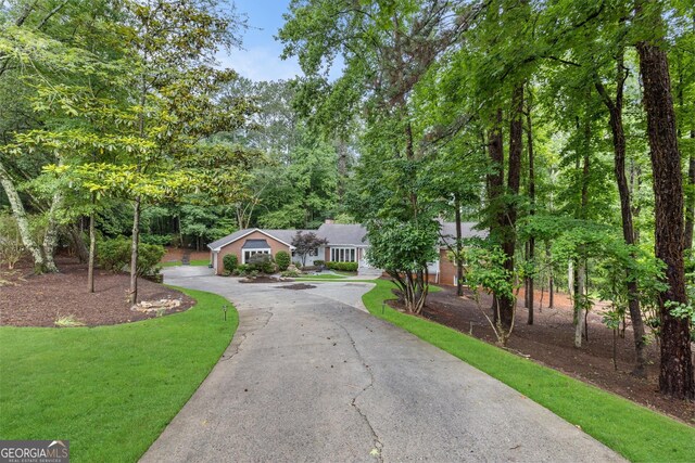 630 Buttercup Trce, Alpharetta, GA 30022 - view of front facade featuring driveway and a front lawn