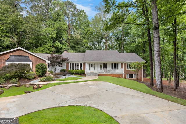 630 Buttercup Trce, Alpharetta, GA 30022 - ranch-style house with a porch, brick siding, a chimney, and a front lawn