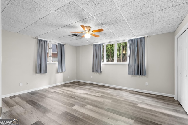 630 Buttercup Trce, Alpharetta, GA 30022 - spare room with wood finished floors, ceiling fan, and baseboards