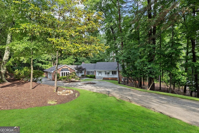 630 Buttercup Trce, Alpharetta, GA 30022 - single story home featuring asphalt driveway, a front lawn, and a garage