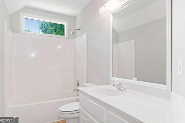 2605 Woodland Hills Dr, Cumming, GA 30040 - full bathroom with toilet, vanity, shower / tub combination, and vaulted ceiling