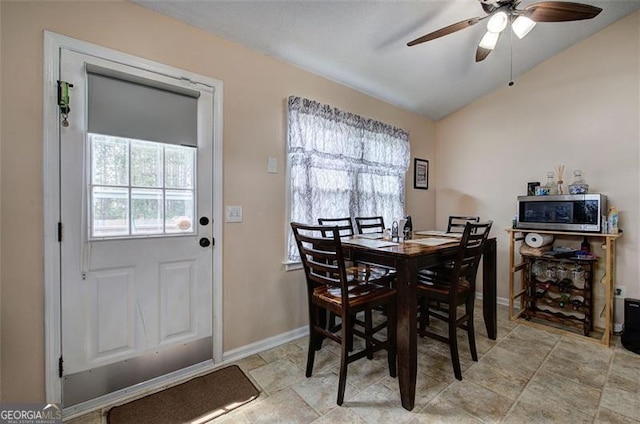 14 Cathedral Hts, Euharlee, GA 30120 - dining area featuring baseboards, vaulted ceiling, a ceiling fan, and light stone finish floors