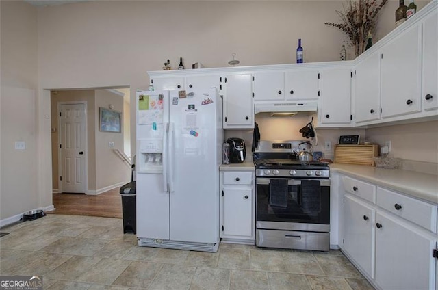 14 Cathedral Hts, Euharlee, GA 30120 - kitchen with stainless steel gas stove, white fridge with ice dispenser, under cabinet range hood, white cabinetry, and light countertops