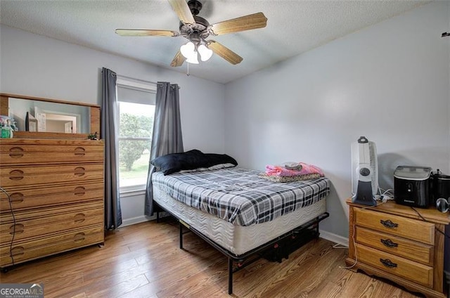 14 Cathedral Hts, Euharlee, GA 30120 - bedroom with light wood-type flooring, baseboards, a textured ceiling, and a ceiling fan