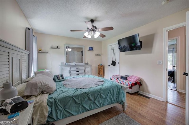 14 Cathedral Hts, Euharlee, GA 30120 - bedroom with wood finished floors, a textured ceiling, baseboards, and ceiling fan