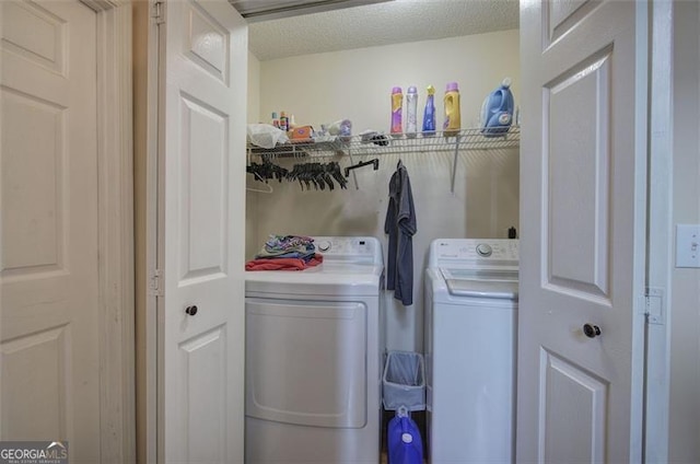 14 Cathedral Hts, Euharlee, GA 30120 - laundry area featuring washing machine and clothes dryer and a textured ceiling