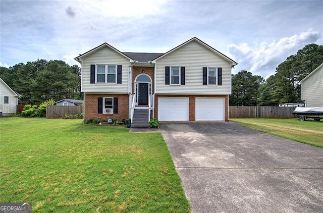 14 Cathedral Hts, Euharlee, GA 30120 - bi-level home with brick siding, an attached garage, and asphalt driveway