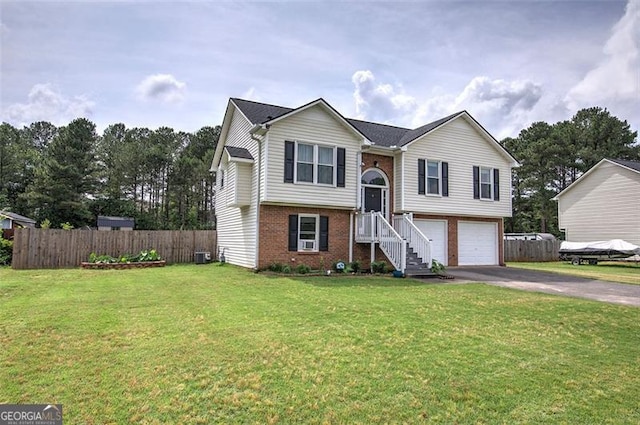 14 Cathedral Hts, Euharlee, GA 30120 - bi-level home with driveway, brick siding, a garage, and central AC