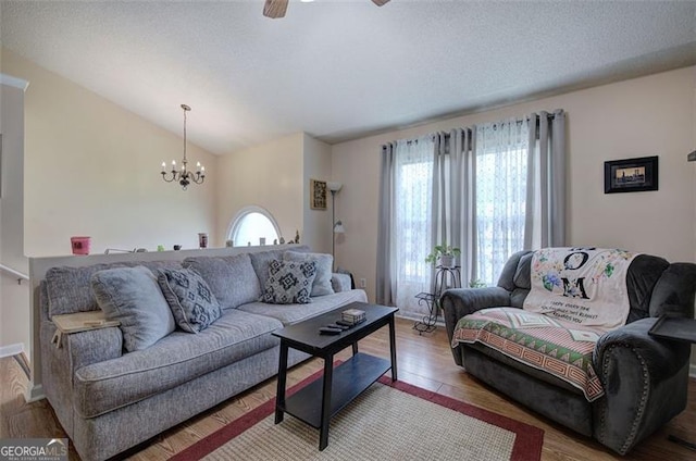 14 Cathedral Hts, Euharlee, GA 30120 - living room featuring a chandelier, wood finished floors, a ceiling fan, and lofted ceiling