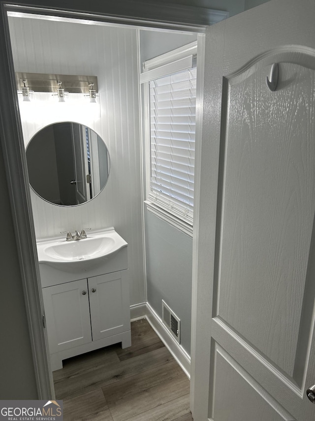 113 Ausband Dr, Mcdonough, GA 30253 - bathroom featuring wood finished floors, vanity, and baseboards