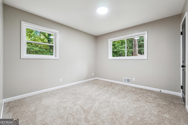 2771 Smithsonia Way, Tucker, GA 30084 - carpeted empty room with plenty of natural light and baseboards