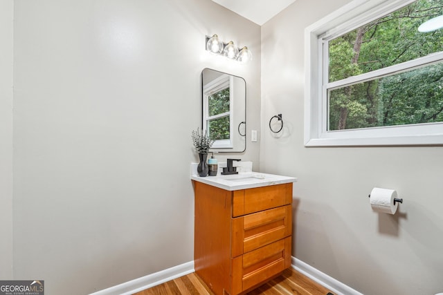 2771 Smithsonia Way, Tucker, GA 30084 - bathroom featuring baseboards, vanity, and plenty of natural light