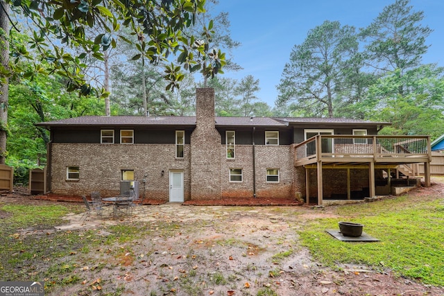 2771 Smithsonia Way, Tucker, GA 30084 - back of house with a chimney, a deck, and brick siding